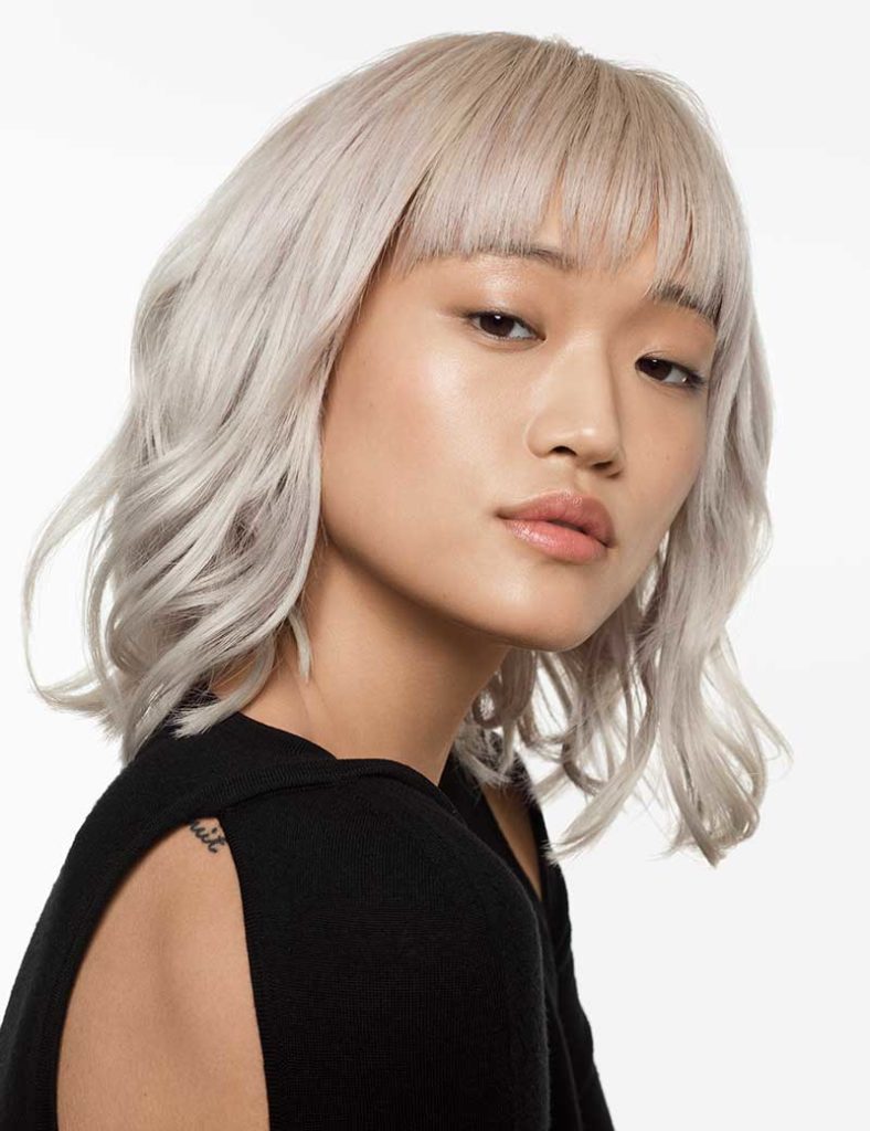 blonde hair on Asian woman coloured at Cardiff hair Salon