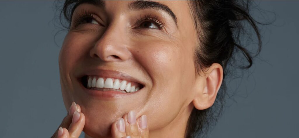Older woman with beautiful skin Dermalogica facials for older women Cardiff